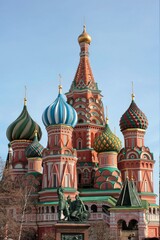 Towers of St. Basil's Cathedral against the background of the blue sea. 