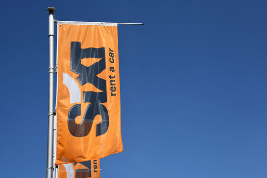 Hanover, Lower Saxony, Germany - May 21, 2020: Flag with a logo of the Sixt international car rental company in Hanover, Germany