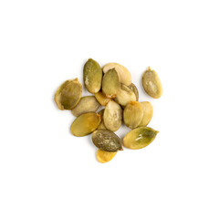 Pumpkin seeds pile isolated on white background top view
