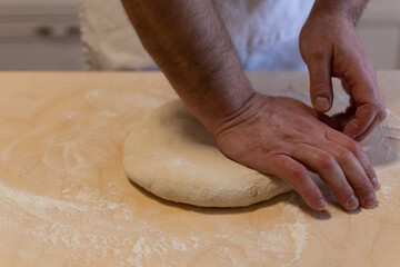 Preparing bread for fried gnocco, one of the best food of the Emilian cuisine