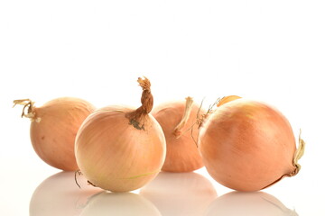 Several fragrant onions, close-up, isolated on white.
