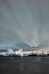 Obraz premium Power plant pipes in Kyiv at night.