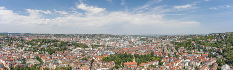 Fototapeta na wymiar Panoramic view of Stuttgart suburb near hills in Germany at summer noon