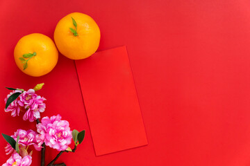 Red envelope put on red background, red envelope is gift, orange and blossom on special days such as chinese new year,