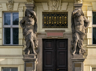 Atlantean statues at the entrance to the building. walking in the historical center of Prague...