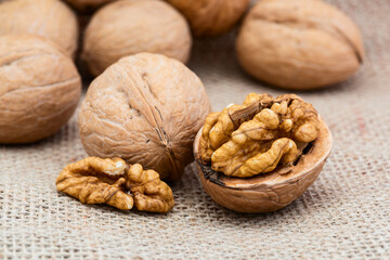 Walnut kernels on a rough cloth background