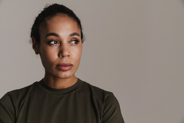 Confident african american soldier woman posing and looking aside