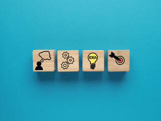 Business process management and action plan concept on a blue background, strategy concept on wooden blocks