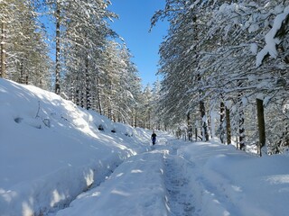 young man running in a snowed mountain