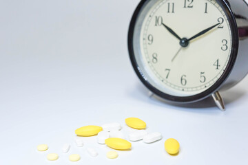 Pharmaceutical medicine pills in both tablets and capsules with the vintage retro picture style. Pharmacy theme and treatment medication as concept.