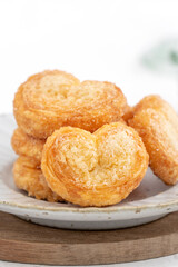 Delicious Palmier butterfly pastry in heart shape for Valentine's day dessert.