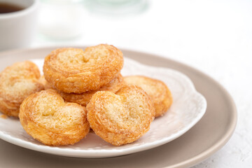 Delicious Palmier butterfly pastry in heart shape for Valentine's day dessert.