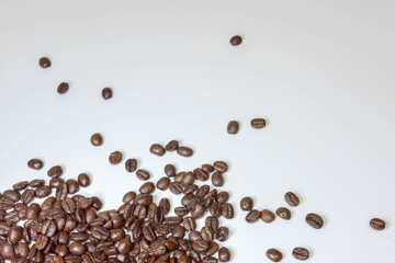 Coffee beans isolated on white background. Close up of a bean of coffee to represent the good smell.