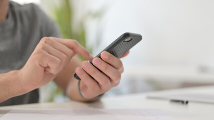 Hands of Young Man Using Smartphone, Close Up 