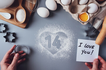 Note I love you, the numbers 14 and a heart of flour. The concept of Valentine's day. Making...