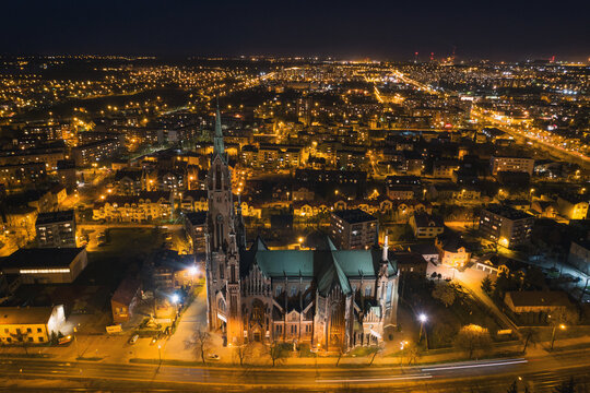 City center at night. Church in city from above. Dabrowa Gornicza silesia, Poland. Aerial drone view