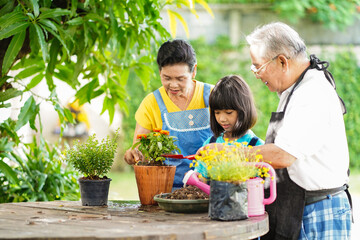 Happy family gardening and taking care of environment do activity outdoor on weekend