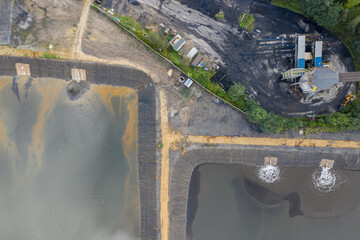 Industrial coal mine, abstract sendimentation tank of mine in Poland. Industrial lake Aerial drone view