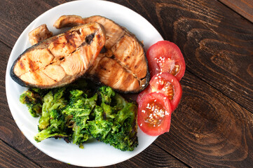 red fish, broccoli and tomatoes, the concept of proper nutrition