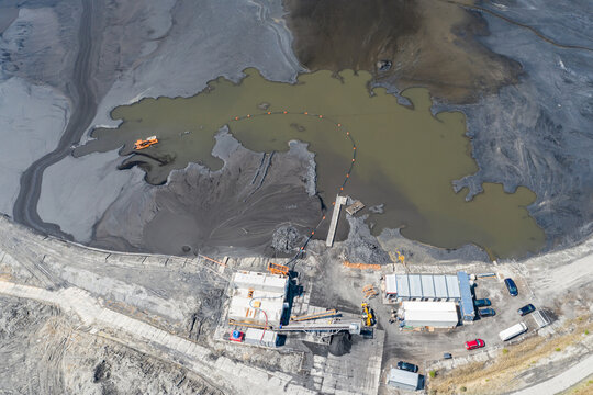Industrial coal mine, abstract sendimentation tank of mine in Poland. Industrial lake Aerial drone view