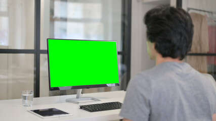 Fototapeta premium Video Call by Businessman on Desktop with Green Chroma Key Screen, 
