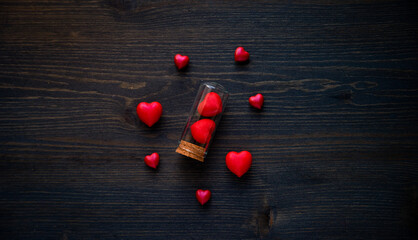 red hearts in bottles for valentines day Greeting card. Flat lay, 