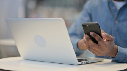 Close Up of Hands Working on Smartphone and Laptop, 