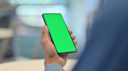 Smartphone with Green Chroma Key Screen in African Hands