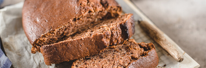 Banner image.. Banana bread sliced. Vegan pastry. Home bakery concept. Close-up