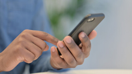 African Man Hands Using Smartphone, Close Up 