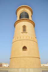 Obraz premium Beautiful and well conserved Al Ayjah lighthouse in contrast with the blue sky. Sur, Oman.