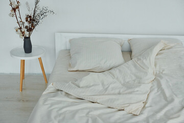 Fototapeta na wymiar White bed. Interior and design of beautiful modern bedroom at daytime