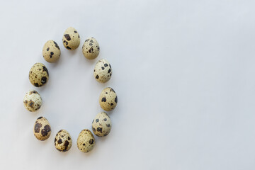 Quail eggs. White background. Top view. Free space. Healthy food concept.