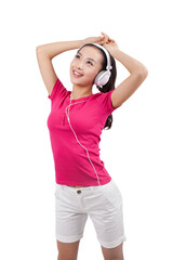 Naklejka premium Young woman listening to music with headphones