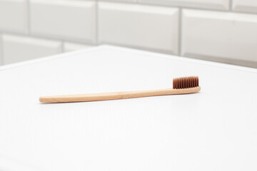 Bamboo toothbrush in the bathroom. Zero waste concept