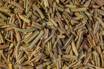 Pile of dried rosemary leaves. Food ingredient texture
