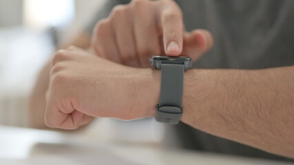 Hands of Young Man Using Smartwatch, Close Up