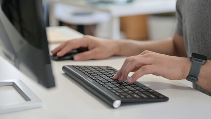 Hands of Young Man Using Mouse and Keyboard, Close Up 