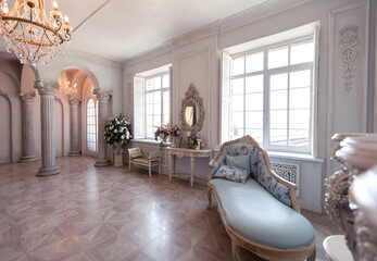 Luxurious light interior of the living room in the baroque style as in a royal castle with old...