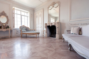 Luxurious light interior of the living room in the baroque style as in a royal castle with old...