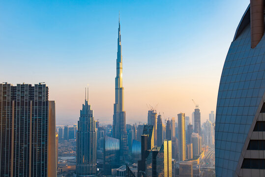 Dubai, United Arab Emirates - Burj Khalifa rising above  downtown skyline view of Dubai at sunset