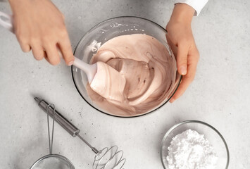 Fototapeta premium Young woman making chocolate cream. Delicious food concept. Great design for any purposes. Flat lay style.