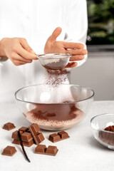 Young woman making chocolate cream. Delicious food concept. Great design for any purposes.