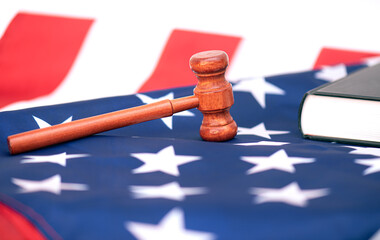 Wooden judge gavel on USA flag, conceptual image about court
