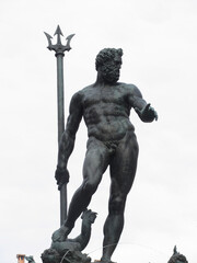 The statue of Neptune in Piazza del Nettuno next to Piazza Maggiore isolated on white background . Bologna Italy