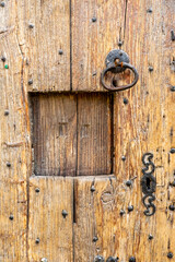 peephole of an old wooden door