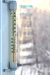 The alcohol thermometer outside the window shows the air temperature minus 24 degrees Celsius....
