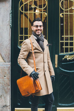 Young Business Man In A Dandy Style Posing At The Front Door