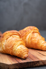 Delicious snack croissant on black background