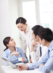 Group of business people discussing in office